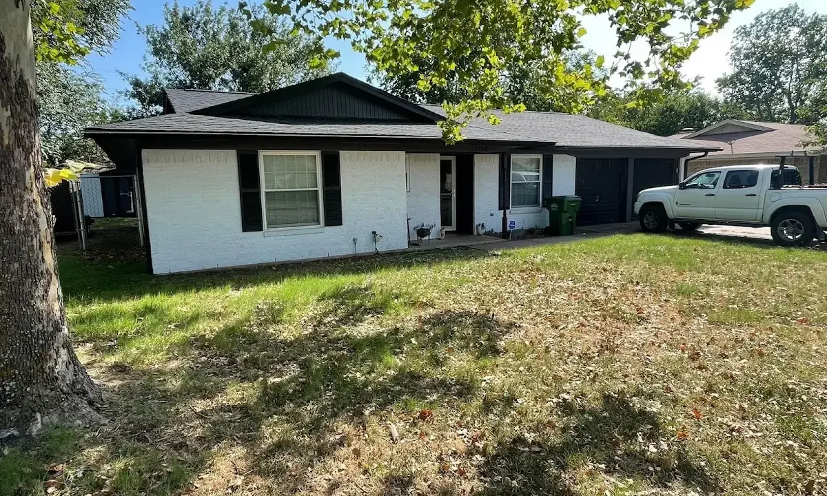 Professional roofing crew working on a residential roof in PiÃ±on Hills